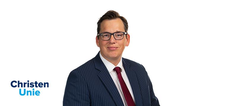 Portretfoto Grinwis met partijlogo CU. 