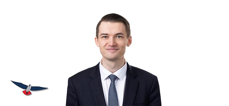 Portretfoto Mooiman met partijlogo PVV.