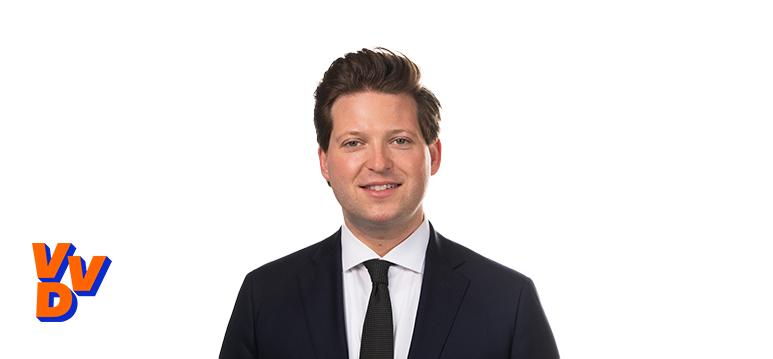 Portretfoto Thom van Campen met partijlogo VVD