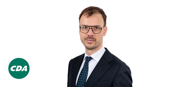 Portretfoto André Poortman met partijlogo CDA